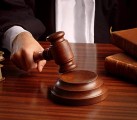 Judge holding a gavel Judge holding a gavel