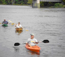 People kayaking on a river People kayaking on a river