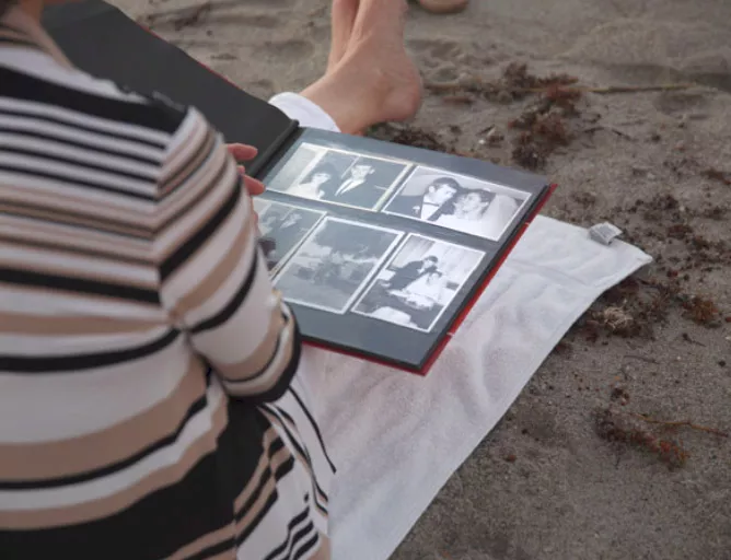 Lorraine Kember with photo album Lorraine Kember with photo album