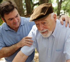 Male Caregiver Taking Care of a Patient Male Caregiver Taking Care of a Patient
