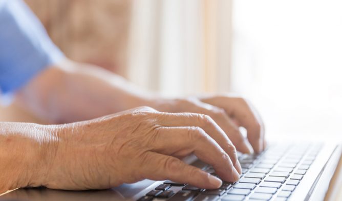 Man typing on keyboard