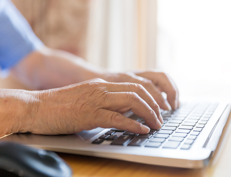 Man typing on keyboard Man typing on keyboard