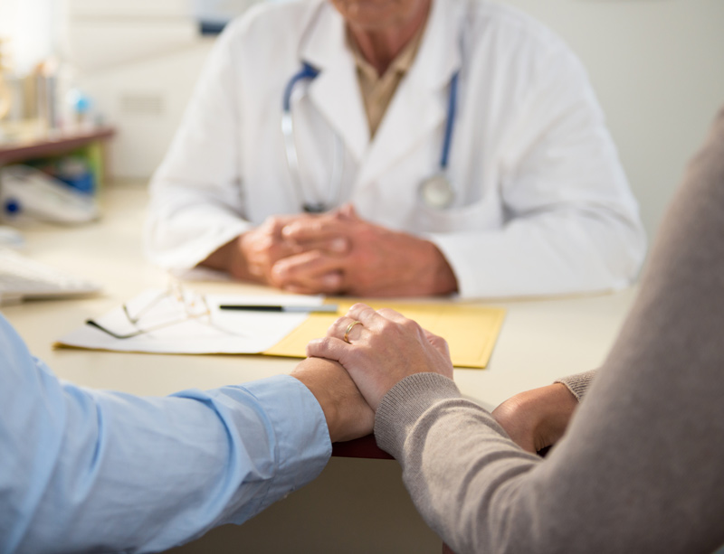 Couple receiving test results Couple receiving test results