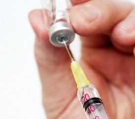 Man taking sample with syringe Man taking sample with syringe