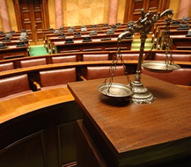 Courtroom with scales in foreground Courtroom with scales in foreground
