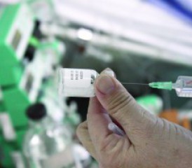Man taking sample with a syringe Man taking sample with a syringe