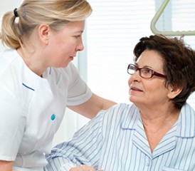 Female nurse with female patient Female nurse with female patient
