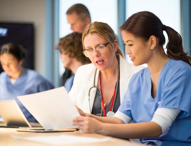 Female nurse with a female doctor Female nurse with a female doctor