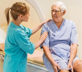 Oncologist speaks with her patient at MRI scanner Oncologist speaks with her patient at MRI scanner