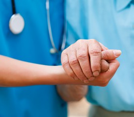 Doctor Holding a Patient's Hand Doctor Holding a Patient's Hand