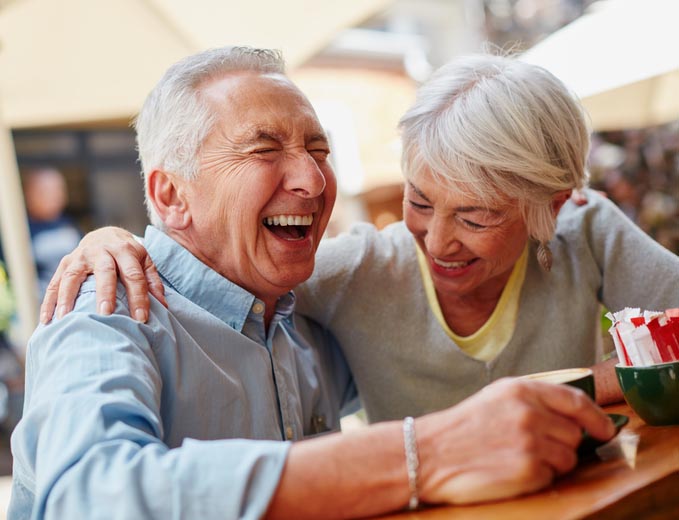 Older couple laughing Older couple laughing