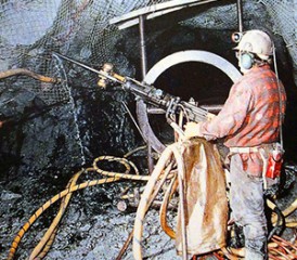 Asbestos workers chipping rocks Asbestos workers chipping rocks