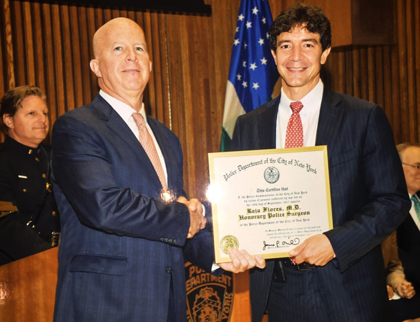 Dr. Raja Flores with New York City Police Commissioner James O’Neill Dr. Raja Flores with New York City Police Commissioner James O’Neill