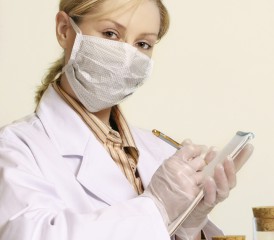 Female researcher with a mask over her mouth Female researcher with a mask over her mouth