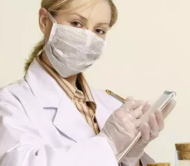Female researcher with a mask over her mouth Female researcher with a mask over her mouth