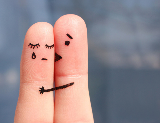 Fingers painted with sad faces Fingers painted with sad faces