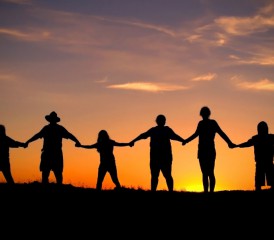 Silhouette of people holding hands