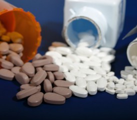 Pills spilling out of bottles