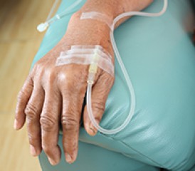 Hand with IV on armrest Hand with IV on armrest