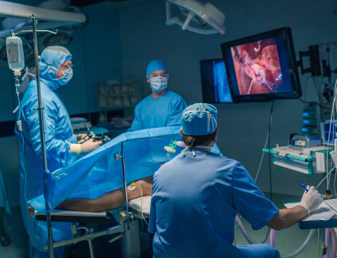 Oncologists performing surgery Oncologists performing surgery