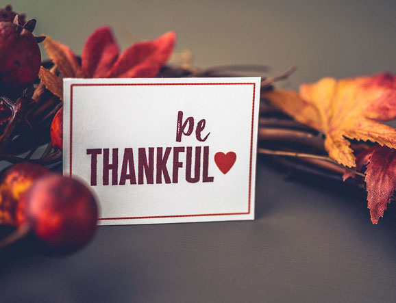 Fall leaves background with wreath and message for Thanksgiving Fall leaves background with wreath and message for Thanksgiving