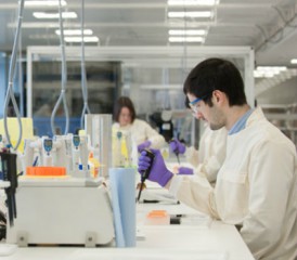 Researcher in a lab with samples Researcher in a lab with samples
