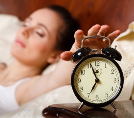 Tired woman with alarm clock Tired woman with alarm clock