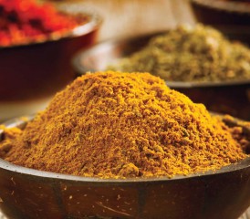 Powdered turmeric in a bowl Powdered turmeric in a bowl