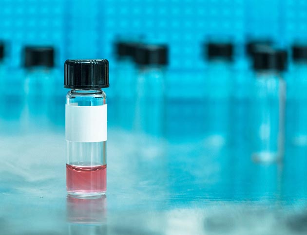 Vaccine vial with red liquid Vaccine vial with red liquid