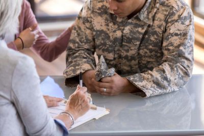 Military veteran and family member getting assistance filing a claim for veteran benefits