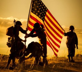 A group of soldiers hoisting the American flag A group of soldiers hoisting the American flag
