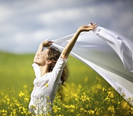 Woman Running Across a Flower Field Woman Running Across a Flower Field