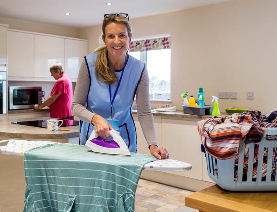 Woman ironing clothes Woman ironing clothes