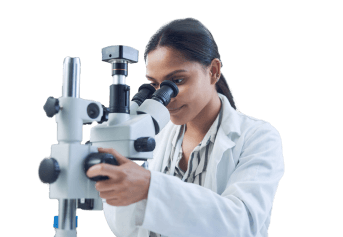 young scientist looking through microscope in lab