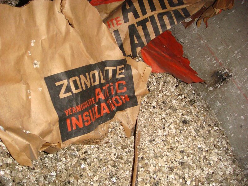 Bag of Zonolite asbestos insulation.